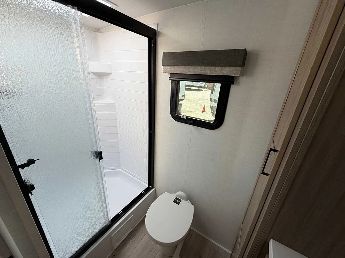 2213S shower with sliding glass door next to the toilet