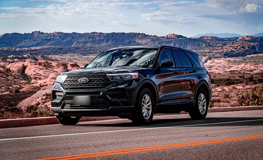 Black Ford Explorer on a desert highway